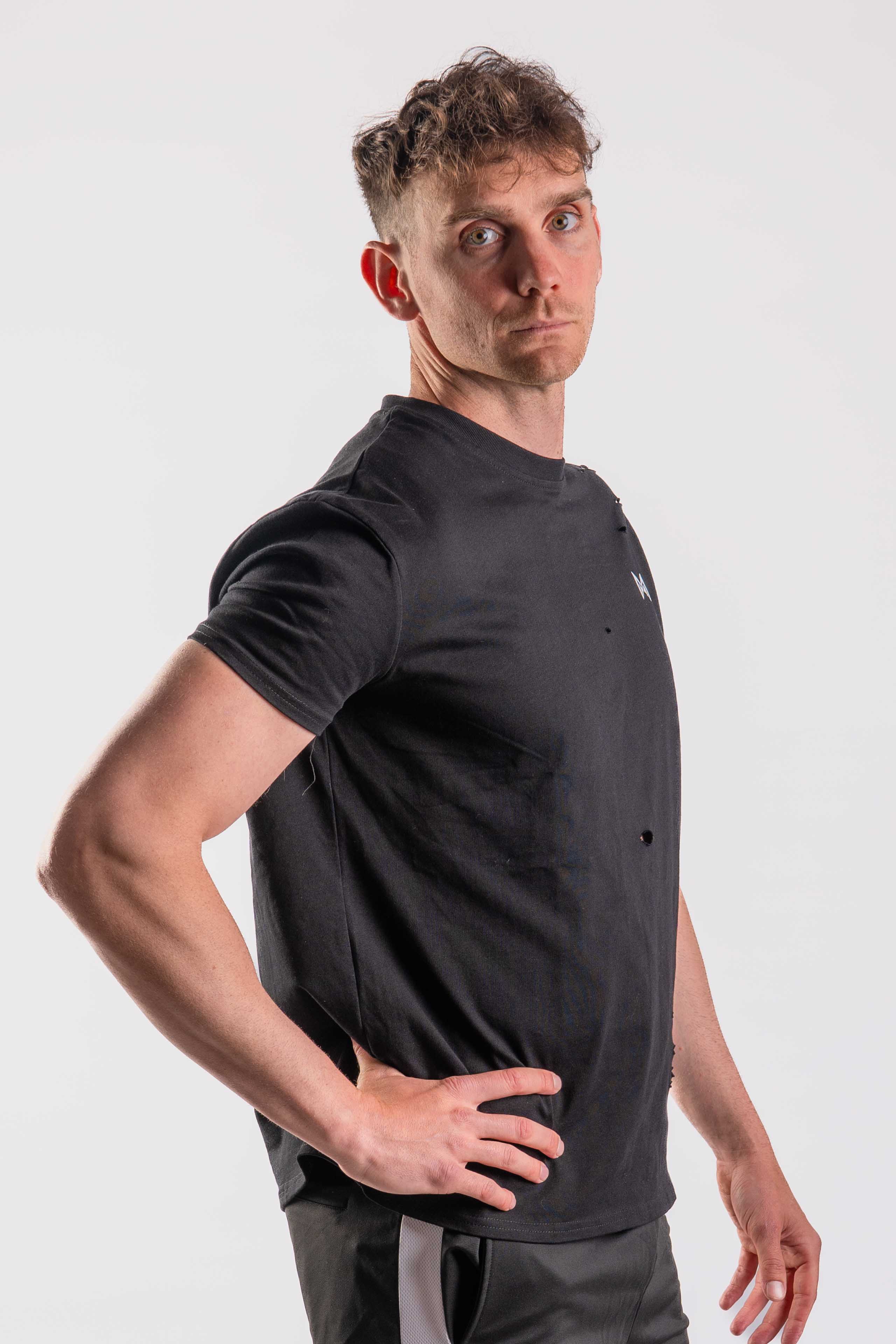 Men’s black athletic T-shirt with distressed cut-outs