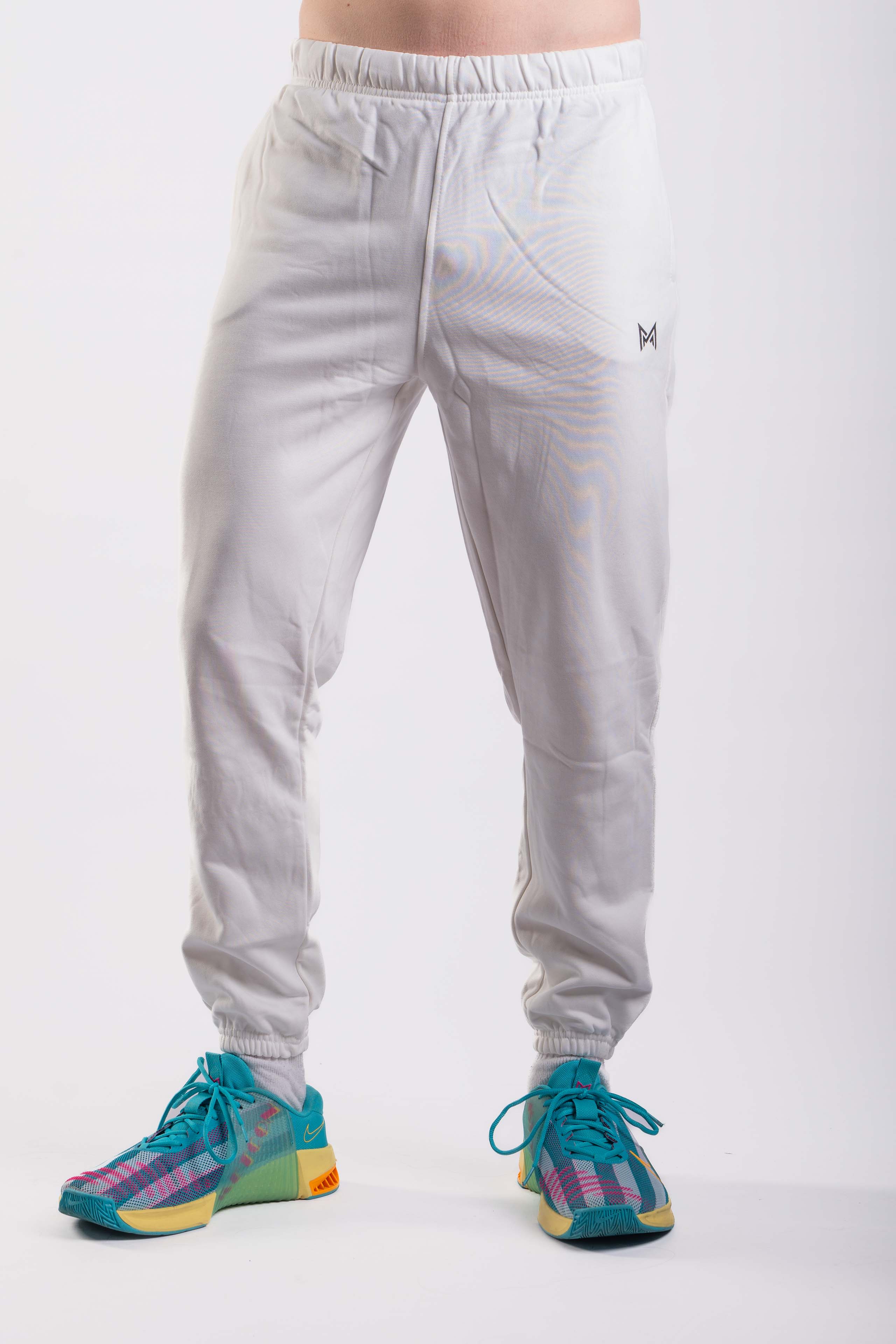 Signature Fit white jogger pants front view with cuffed ankles