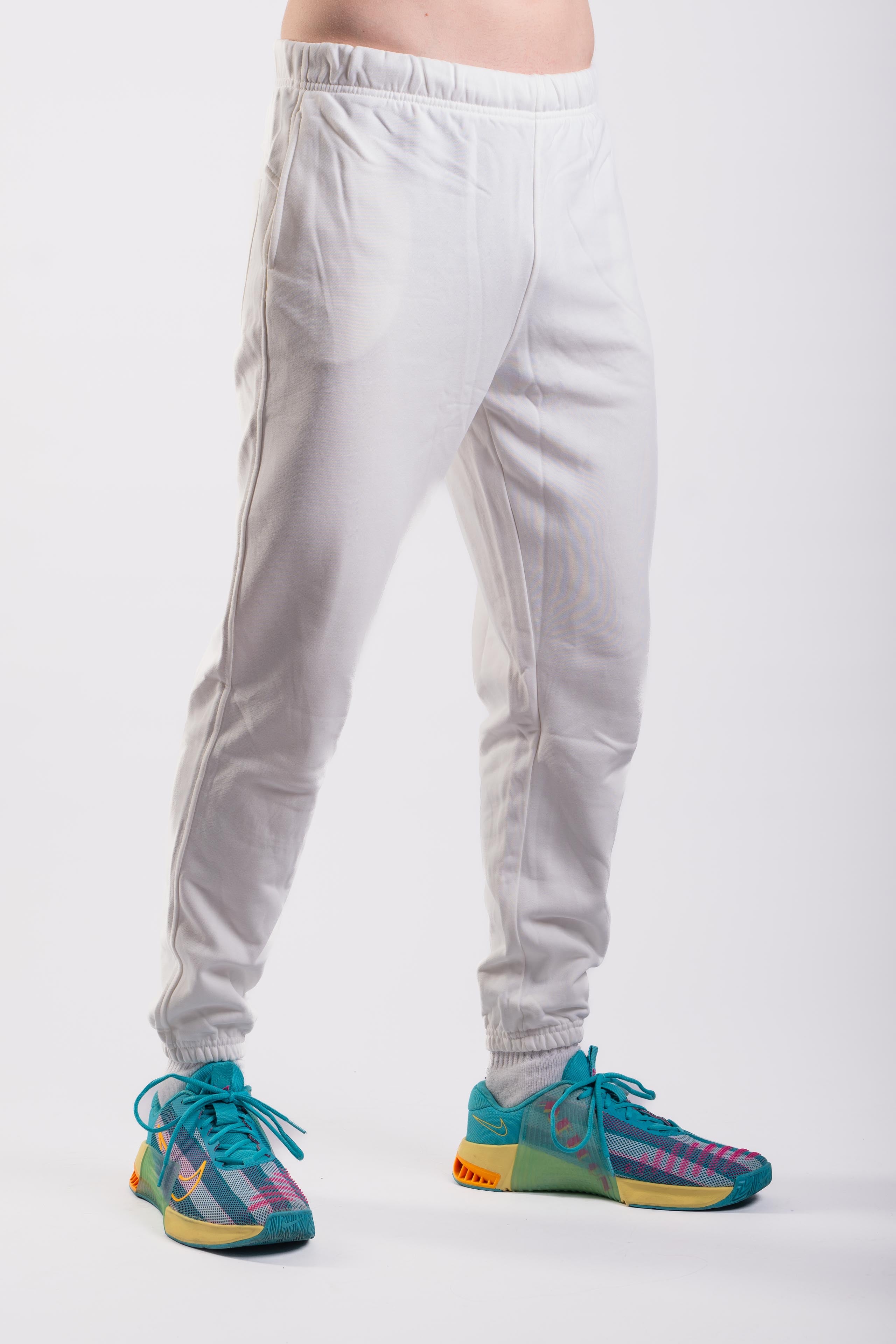 Men’s white tapered jogger pants side view with elasticated cuffs